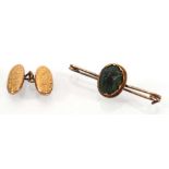 A 9ct yellow gold bar brooch set beetle and a single yellow metal cufflink, overall 4.3 gms (2)