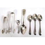 A small group of silver comprising three rats tail teaspoons, a fiddle pattern teaspoons, a salt