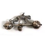 An early 20th century silver rattle modelled as a crawling monkey, maker C&N, other hallmarks