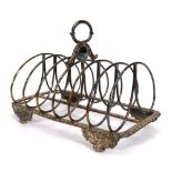 A George IV silver six slice toast rack with gadrooned decoration, Sheffield 1828, w. 16.5 cm, 7.6