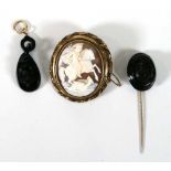 A gilt metal mounted cameo brooch of oval form depicting George and the Dragon, l. 5.2 cm,