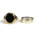 A 9ct yellow gold signet ring set black hardstone, ring size V 1/2 and a 9ct two colour band ring,