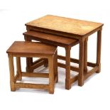 Robert 'Mouseman' Thompson of Kilburn, a nest of three oak occasional tables, each with the