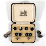 A cased set of silver, black enamel and pearl set dress studs in the Art Deco manner, together