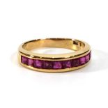An 18ct yellow gold half eternity ring set ten square cut rubies in a channel setting,ring size O,