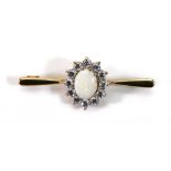 A 9ct yellow gold bar brooch set opal and paste cluster, w, 3.6 cm, 2.6 gms