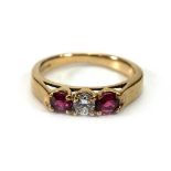 A 9ct yellow gold dress ring set three clear and pink paste,ring size G,2 gms