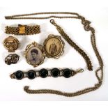 A group of gold coloured jewellery comprising a banded agate bracelet, two further bracelets, a long