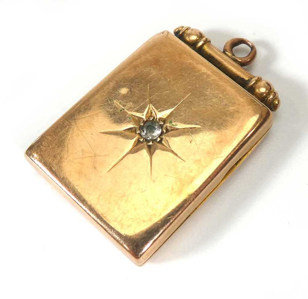 A 9ct yellow gold rectangular locket set small diamond in a recessed star setting, l. 3..2 cm, 7.4