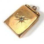 A 9ct yellow gold rectangular locket set small diamond in a recessed star setting, l. 3..2 cm, 7.4