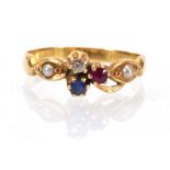 An 18ct yellow gold ring set diamond, ruby, sapphire and two small pearls in a cluster setting,