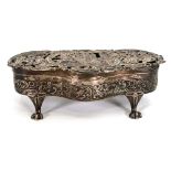 An Edwardian stamped silver dressing table box decorated with a marriage scene, maker WC, London