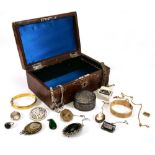 A small early 20th century jewellery box containing a group of jewellery including a carved lava