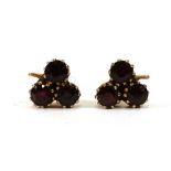 A pair of yellow metal clover design ear studs, each set three purple stones, 2.7 gms (2)