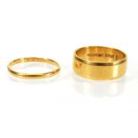 A 22ct yellow gold wedding band, band w. 7 mm, ring size R, Birmingham 1970 and a further 22ct