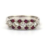 An 18ct white gold ring set five brilliant cut diamonds interspersed with eight small rubies, ring