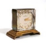 A miniature desk timepiece by Home Watch Co., the circular dial with gold coloured baton and