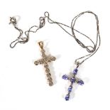 A 9ct white gold fine boxlink necklace suspending a cross pendant set tanzanite coloured stones