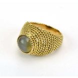 Boucheron, a yellow gold bombe ring set cabochon moonstone within a ropetwist setting, signed to