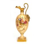 A Royal Worcester ivory blush ewer of urn shaped form with grotesque mask handle and typically