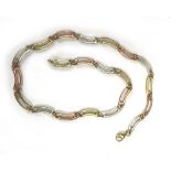 A 9ct tri-colour gold elongated open wave link necklace, l. 40 cm, 20.1 gms