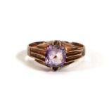 A rose metal dress ring set cushion cut amethyst in a ten claw setting,ring size S,3.4 gms.
