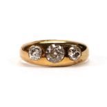 An 18ct yellow gold gypsy ring set three graduated old cut diamonds in recessed settings, Chester