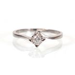 An 18ct white gold crossover ring set brilliant cut diamond in an illusion setting, ring size P, 2.3