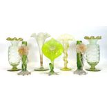 Seven early 20th century green vaseline glass vases, max h. 25 cm (7)No obvious damage