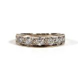 A white gold half eternity ring set seven graduated brilliant cut diamonds,ring size J,2.7 gms