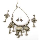 An Indian metalware necklace and matching ear pendants, together with a pair of similar earrings (