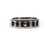 An 18ct white gold half eternity ring set two rows of small sapphires and diamonds, the sides each