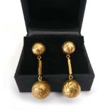 A pair of yellow metal engraved ball link ear pendants, l. 3.2 cm, overall 5.9 gms (2)No