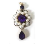 A yellow metal mounted pendant of cluster form centrally set heart shaped amethyst within a border