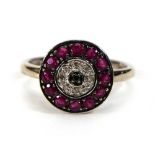 A 9ct white gold cluster ring set small diamonds and rubies in a circular setting,ring size L,2.5