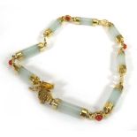 A 14ct yellow gold mounted green hardstone bracelet, l. 18 cm, 6.8 gms