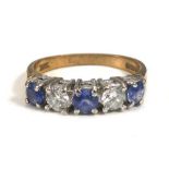 A 9ct yellow gold ring set three pale sapphires interspersed with two diamonds,ring size M,2.4 gms