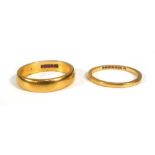 Two 22ct yellow gold wedding bands, ring sizes K 1/2 and M,overall 7.1 gms (2)