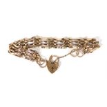 A 9ct yellow gold four bar gatelink bracelet with heart shaped padlock clasp, 9.4 gms