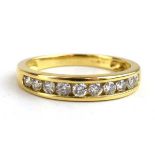 An 18ct yellow gold half eternity ring set ten brilliant cut diamonds in tension settings, ring size