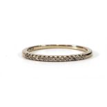 An 18ct white gold half eternity ring set fifteen small diamonds,ring size L,1.3 gms