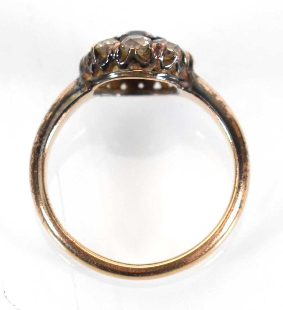 An early 20th century 15ct yellow gold cluster ring set round cut sapphire within a border of - Image 4 of 4