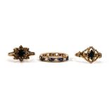 Two 9ct yellow gold dress rings set sapphires and a yellow metal eternity ring set clear and blue