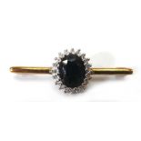 A 9ct yellow gold bar brooch set sapphire and diamond cluster, w. 3.5 cm, 2.9 gms