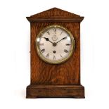 A 1938 E.W. Elliott Ltd. RAF 'mess' mantel clock, No. 4607, the silvered dial with an RAF crest,