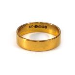 A 22ct yellow gold wedding band, band w. 5 mm, London 1968,ring size K 1/2,3.3 gmsHeavy wear
