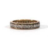 A 9ct yellow gold eternity ring set small diamonds,ring size L,2.3 gms
