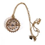 A gold plated curblink necklace suspending an (?)American yellow metal openwork pendant/brooch of