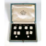 A set of 9/18ct yellow and white gold engined turned dress studs, each decorated with mother of
