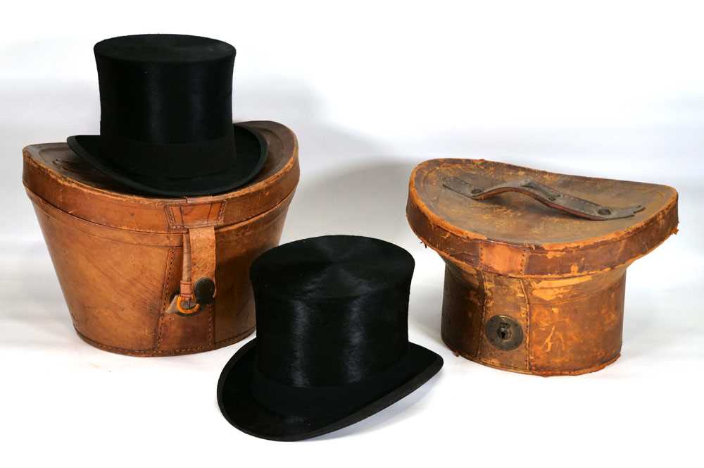 A Victorian leather hat boxes containing a silk top hat by R. Womack, together with another